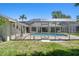 Enjoy this beautiful screened pool and patio, perfect for lounging or enjoying a meal outdoors at 13553 Glaze Brook Dr, Hudson, FL 34667