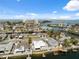 Real estate aerial view, displaying waterfront community with canal access, highlighting nearby beach and amenities at 13810 Malcolm Ave, Hudson, FL 34667