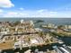 Waterfront neighborhood aerial featuring many homes on canals with access to the Gulf of Mexico on a sunny day at 13810 Malcolm Ave, Hudson, FL 34667