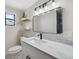 Bathroom boasts a large vanity, modern lighting, and a sleek design at 13810 Malcolm Ave, Hudson, FL 34667