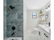 Modern bathroom with a tiled shower, sleek vanity, and stylish fixtures, offering a luxurious experience at 13810 Malcolm Ave, Hudson, FL 34667