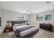 Bright bedroom with neutral decor, plush bed, and ample natural light offers relaxation and style at 13810 Malcolm Ave, Hudson, FL 34667