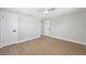 Bright bedroom featuring a ceiling fan and hardwood floors, offering a comfortable and versatile space at 13810 Malcolm Ave, Hudson, FL 34667