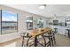 Dining area combines modern style with scenic waterfront views, creating a perfect dining experience at 13810 Malcolm Ave, Hudson, FL 34667