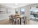 Cozy dining room with water views, modern decor, and ample natural light at 13810 Malcolm Ave, Hudson, FL 34667