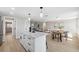 Bright and spacious, the open concept kitchen features a center island, and flows to the dining and living areas at 13810 Malcolm Ave, Hudson, FL 34667