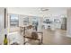 Open-concept with stainless steel appliances and an island that adjoins the dining space at 13810 Malcolm Ave, Hudson, FL 34667