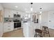 Modern white kitchen with stainless steel appliances and marble countertops at 13810 Malcolm Ave, Hudson, FL 34667