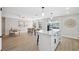 Bright open concept kitchen with center island open to the dining area with plenty of natural light at 13810 Malcolm Ave, Hudson, FL 34667