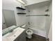 Bathroom featuring a shower and tub combo with modern fixtures and a vanity at 13909 Fletchers Mill Dr, Tampa, FL 33613