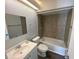 Bathroom featuring a shower and tub combo with modern fixtures and a vanity at 13909 Fletchers Mill Dr, Tampa, FL 33613