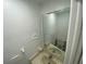 Simple bathroom with a clean white toilet and sink under a mirror at 13909 Fletchers Mill Dr, Tampa, FL 33613