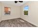 Empty bedroom with modern vinyl floors, neutral walls, and plenty of natural light at 1419 55Th S St, Gulfport, FL 33707