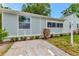 Well-maintained house exterior with a tidy lawn and landscaped garden beds at 1419 55Th S St, Gulfport, FL 33707