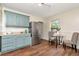 Stylish kitchen featuring stainless steel appliances, ample cabinet space, and a dining area for added convenience at 1419 55Th S St, Gulfport, FL 33707