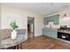 Well-lit kitchen featuring blue cabinets, tiled backsplash, and modern appliances, perfect for cooking enthusiasts at 1419 55Th S St, Gulfport, FL 33707