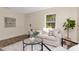 Inviting living room with a comfortable couch, large window, and views of the outdoors at 1419 55Th S St, Gulfport, FL 33707