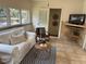 This living room features a cozy couch, television, and neutral decor at 1419 55Th S St, Gulfport, FL 33707