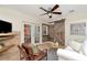 Charming living room with a barn door, tile floor and access to the outdoor area through French doors at 1419 55Th S St, Gulfport, FL 33707