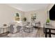 Bright living room features hardwood floors, neutral decor and natural light, creating a comfortable living space at 1419 55Th S St, Gulfport, FL 33707