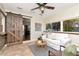 Bright living room featuring tile flooring, a barn door, and comfortable seating near large windows at 1419 55Th S St, Gulfport, FL 33707