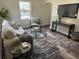 The well-lit living room offers hardwood floors, tasteful decor, and an open layout for easy living at 1419 55Th S St, Gulfport, FL 33707