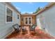 Charming outdoor patio features tile flooring and wicker furniture, perfect for relaxing at 1419 55Th S St, Gulfport, FL 33707