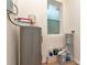 This utility room features a water heater and a window at 1419 55Th S St, Gulfport, FL 33707