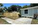 Side yard featuring a new wooden fence and landscaping at 1419 55Th S St, Gulfport, FL 33707
