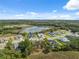 Wonderful aerial view of the community, showcasing lush landscapes, tranquil lakes, and meticulously designed homes in the neighborhood at 15615 Serengeti Blvd, Spring Hill, FL 34610