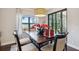 Comfortable dining space with bench seating and view of the outdoor patio at 15615 Serengeti Blvd, Spring Hill, FL 34610
