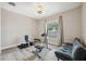 Exercise room boasts wood floors and exercise equipment, lit by a modern ceiling fan at 15615 Serengeti Blvd, Spring Hill, FL 34610