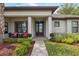 Cozy front porch featuring comfortable seating and decorative plants, creating a welcoming entrance at 15615 Serengeti Blvd, Spring Hill, FL 34610