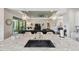 A kitchen island with granite counters and a black sink overlooks the living room at 15615 Serengeti Blvd, Spring Hill, FL 34610