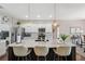 Stylish kitchen with a large island, granite countertops, stainless steel appliances, and barstool seating at 15615 Serengeti Blvd, Spring Hill, FL 34610