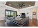 Comfortable living room with large sectional, tv, and sliding doors to the screened lanai at 15615 Serengeti Blvd, Spring Hill, FL 34610