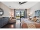 Comfortable main bedroom with decorative furnishings and patio access with views at 15615 Serengeti Blvd, Spring Hill, FL 34610