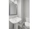 Modern bathroom features a pedestal sink and patterned tile flooring at 206 S Tampania Ave # 4, Tampa, FL 33609