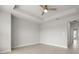 Spacious bedroom with tray ceiling and ensuite bathroom access at 206 S Tampania Ave # 4, Tampa, FL 33609