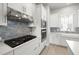 Modern kitchen featuring stainless steel appliances, a gas range and a center island at 206 S Tampania Ave # 4, Tampa, FL 33609