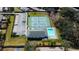 Aerial view showcasing the tennis courts, pool and clubhouse in the community at 2547 Stony Brook Ln, Clearwater, FL 33761