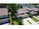 Aerial view highlighting the property's layout and proximity to neighboring houses in a residential area at 2547 Stony Brook Ln, Clearwater, FL 33761
