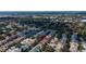 Aerial view of the community with tree lined streets and mature landscaping at 2547 Stony Brook Ln, Clearwater, FL 33761