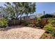Paver patio in a fenced backyard with mature trees and landscaping at 2547 Stony Brook Ln, Clearwater, FL 33761