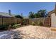 Private backyard featuring a brick-paved patio and mature landscaping at 2547 Stony Brook Ln, Clearwater, FL 33761