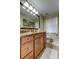 Bathroom features a large vanity, decorative lighting, and tile flooring at 2547 Stony Brook Ln, Clearwater, FL 33761