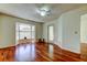 Spacious bedroom with hardwood floors, a bay window, and a ceiling fan at 2547 Stony Brook Ln, Clearwater, FL 33761