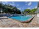 An inviting community pool with ample lounge chairs and a serene atmosphere at 2547 Stony Brook Ln, Clearwater, FL 33761