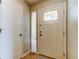 Welcoming foyer features a front door with decorative glass and a convenient coat closet at 2547 Stony Brook Ln, Clearwater, FL 33761