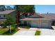 Charming single-story home with a well-manicured lawn and two-car garage at 2547 Stony Brook Ln, Clearwater, FL 33761